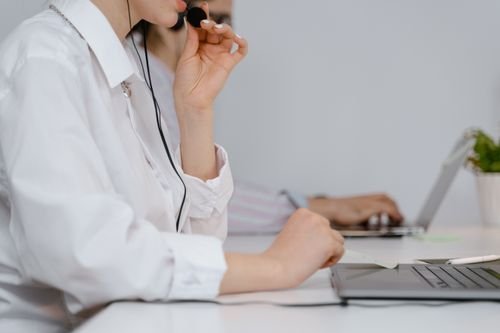 Back office operations specialist at her desk